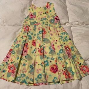 Yellow dress with flowers on it